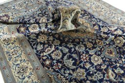 Surface texture of 2000s Nain rug with natural Wool and intricate pattern