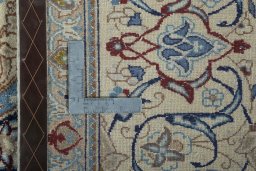Backside of handmade 2000s Nain rug showing knot structure and weave density