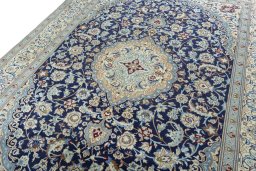 Backside of handmade 2000s Nain rug showing knot structure and weave density
