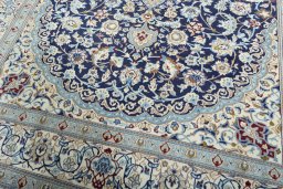 Close-up detail of 2000s Nain rug from Iran / Persia showing Wool weave