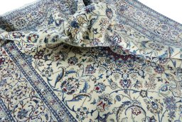 Surface texture of 2000s Nain rug with natural Wool and intricate pattern