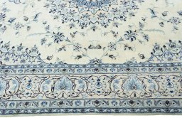 Corner detail of New Nain rug showing border pattern and Wool pile