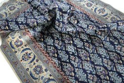 Corner detail of New Nain rug showing border pattern and Wool pile