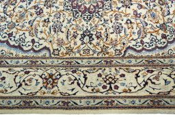 Corner detail of 2000s Nain rug showing border pattern and Wool pile