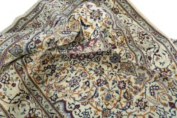 Surface texture of 2000s Nain rug with natural Wool and intricate pattern