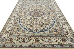 Surface texture of 2000s Nain rug with natural Wool and intricate pattern