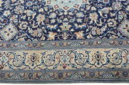 Corner detail of 2000s Nain rug showing border pattern and Wool pile