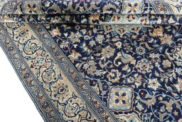 Close-up detail of 2000s Nain rug from Iran / Persia showing Wool weave