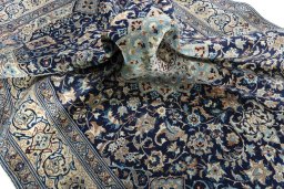Surface texture of 2000s Nain rug with natural Wool and intricate pattern