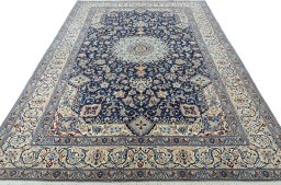 Surface texture of 2000s Nain rug with natural Wool and intricate pattern