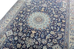 Backside of handmade 2000s Nain rug showing knot structure and weave density