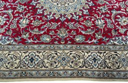 Corner detail of New Nain rug showing border pattern and Wool pile