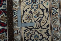 Backside of handmade New Nain rug showing knot structure and weave density