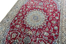 Backside of handmade New Nain rug showing knot structure and weave density