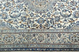 Corner detail of 2000s Nain rug showing border pattern and Wool pile