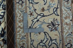 Backside of handmade 2000s Nain rug showing knot structure and weave density