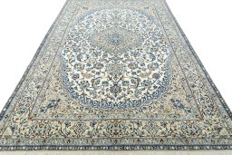 Surface texture of 2000s Nain rug with natural Wool and intricate pattern