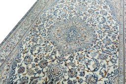 Backside of handmade 2000s Nain rug showing knot structure and weave density