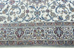 Corner detail of 2000s Nain rug showing border pattern and Wool pile