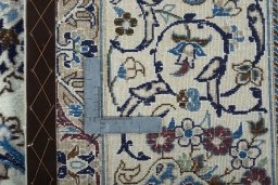Backside of handmade 2000s Nain rug showing knot structure and weave density