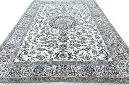 Surface texture of 2000s Nain rug with natural Wool and intricate pattern