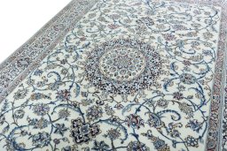 Backside of handmade 2000s Nain rug showing knot structure and weave density