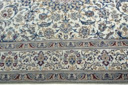 Corner detail of 2000s Nain rug showing border pattern and Wool pile