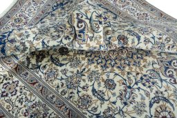 Surface texture of 2000s Nain rug with natural Wool and intricate pattern