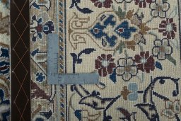 Backside of handmade 2000s Nain rug showing knot structure and weave density