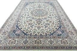 Surface texture of 2000s Nain rug with natural Wool and intricate pattern
