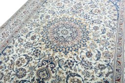 Backside of handmade 2000s Nain rug showing knot structure and weave density