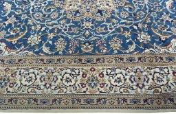 Corner detail of 2000s Nain rug showing border pattern and Wool pile