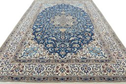 Surface texture of 2000s Nain rug with natural Wool and intricate pattern