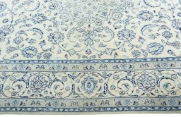 Corner detail of New Nain rug showing border pattern and Wool pile