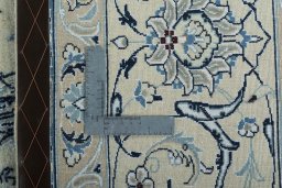 Backside of handmade New Nain rug showing knot structure and weave density
