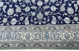 Corner detail of 2000s Nain rug showing border pattern and Wool pile