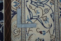 Backside of handmade 2000s Nain rug showing knot structure and weave density