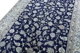 Backside of handmade 2000s Nain rug showing knot structure and weave density