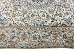 Corner detail of 2000s Nain rug showing border pattern and Wool pile