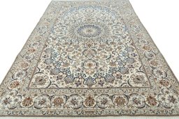 Surface texture of 2000s Nain rug with natural Wool and intricate pattern
