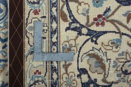 Backside of handmade 2000s Nain rug showing knot structure and weave density