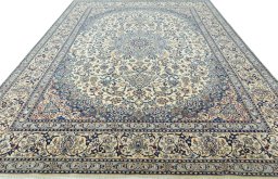 Surface texture of 2000s Nain rug with natural Wool and intricate pattern