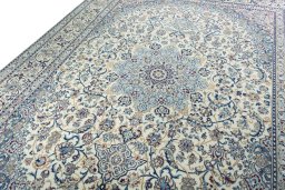 Backside of handmade 2000s Nain rug showing knot structure and weave density