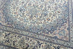 Close-up detail of 2000s Nain rug from Iran / Persia showing Wool weave