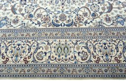 Corner detail of 2000s Nain rug showing border pattern and Wool pile
