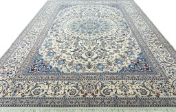 Surface texture of 2000s Nain rug with natural Wool and intricate pattern
