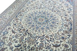 Backside of handmade 2000s Nain rug showing knot structure and weave density