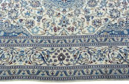 Corner detail of 2000s Nain rug showing border pattern and Wool pile