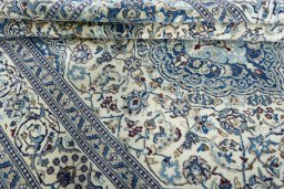 Close-up detail of 2000s Nain rug from Iran / Persia showing Wool weave