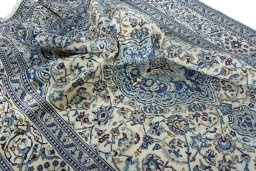 Surface texture of 2000s Nain rug with natural Wool and intricate pattern
